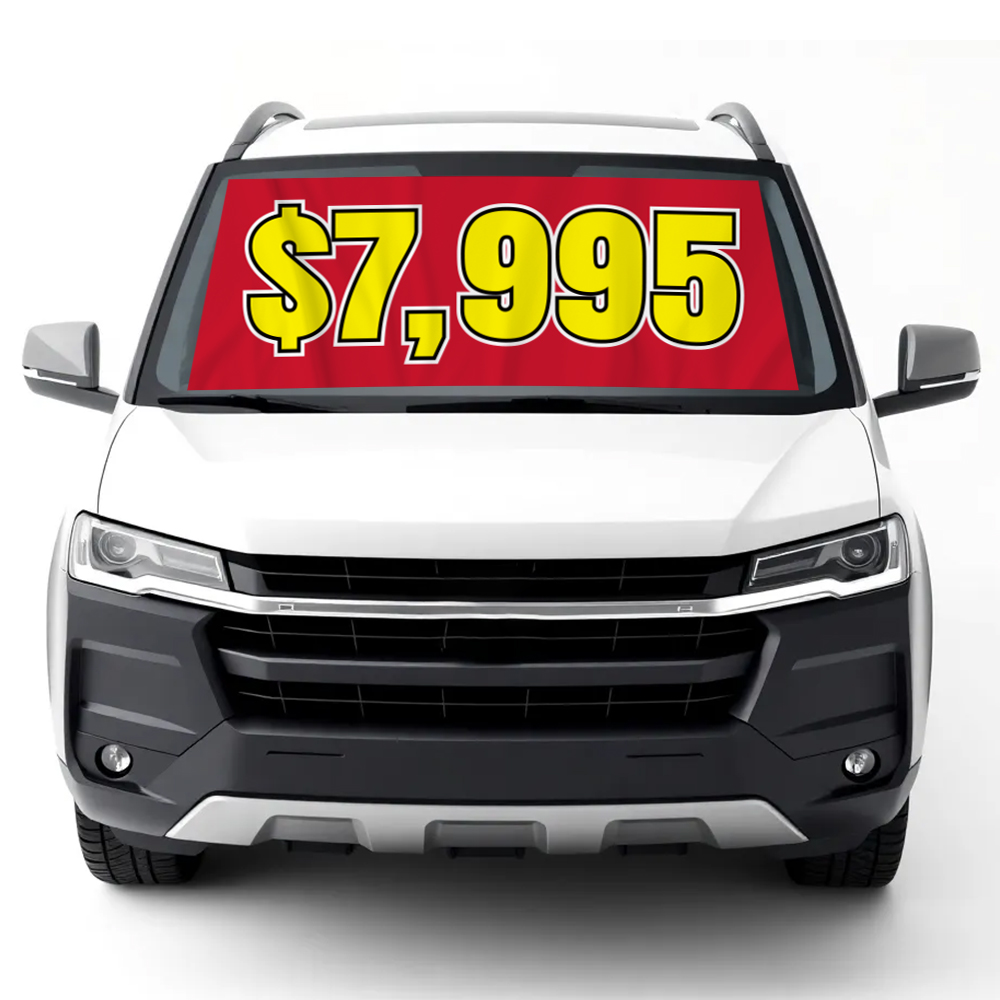 $7,995 red windshield banner displayed on car for auto dealership pricing