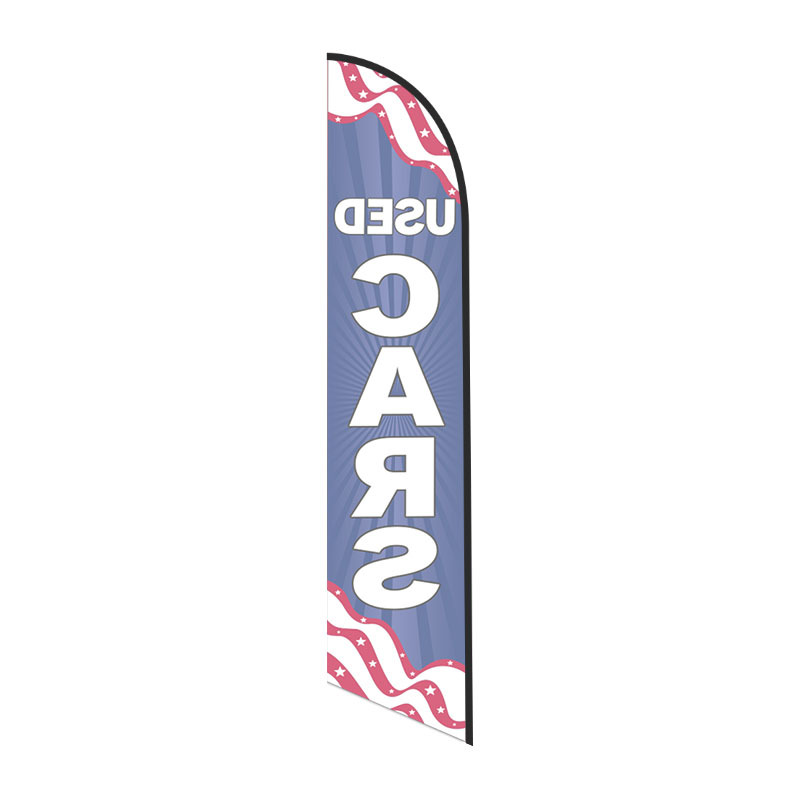 Reverse view of patriotic USED CARS feather flag with red, white, and blue wave pattern.